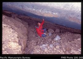[My son, Kalman N. Muller, inspects the underside of a glacier near Puncak Jaya]