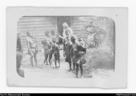 Group of women and children outside building, probably Malekula