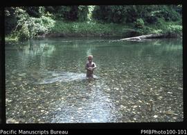 "Child in Tinahulu river, Guadalcanal"