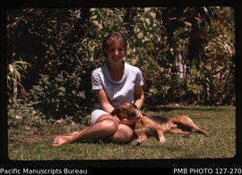 'Liz and dog Snooky in the garden at 30 Beach Road, Fiji'