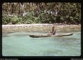 'Boy in canoe at Buni, near Wana Wana Lagoon'