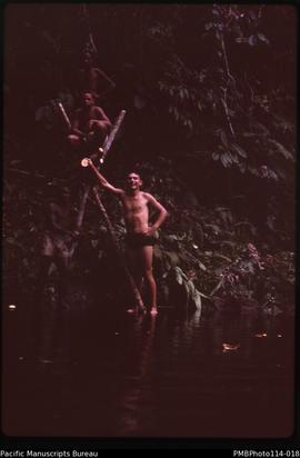 'Geology staff relax with sheerlegs diving platform on Lunga River, Guadalcanal with John Baker VSO'