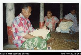 Grandfather Salu holding baby Katerina with Tatu and Tautino watching. Satupaitea, Savaii