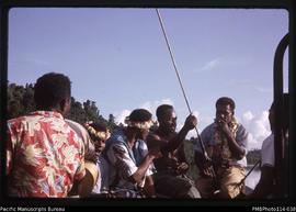 'Fijian members of rugby team on ships bows going through Ngella Passage'