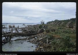 'Wagina Island coastline with toilets and houses, looking towards Choiseul'