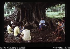 'Elder Fiama leads a Bible study under a banyan'