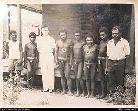 'Our first bushboys to come to church.' (L-R) two men name unknown, Conrad Stallan, Kailang Buluk...