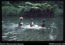 "Women washing in River Tinahulu, Guadalcanal"