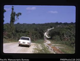'Lyn's [Lynette Walker] car on Efate road. Snake Hill, road to Onesua, Vila'