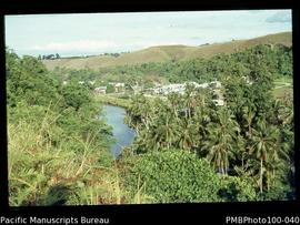 "New Chinatown from hill on west side of Matanikau river, Honiara, with Bloody Ridge (WW2) b...