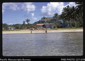 'Beach with cargo and copra driers at Mualevu village, Fiji'