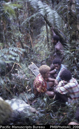 '[Group] Rest on way up north east ridge, Mt Popomanisiu, Guadalcanal'
