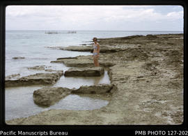 'Excavations for coral blocks for Langi tombs, on Pangaimotu Island, with fish fence in backgroun...