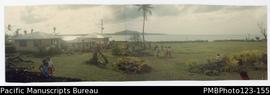 View from the Samoan guest house across the malae (oval) and Palauli Bay with compound residences...
