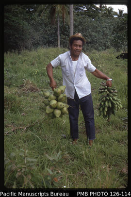 'Bunch of dwarf coconuts and bunch of bananas with Edward Mafi, Tonga'