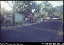 Waiting for village post office to open, bringing news of remittances, Upolu, Samoa