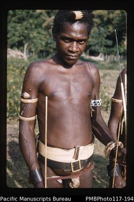 'Full dress parade. A friendly fellow. Tortoise shell and a wooden bracelet. Pipe. Comb. Belt.'