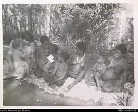 'The wives of two men', Christina Stallan (left) with women and children, Malekula