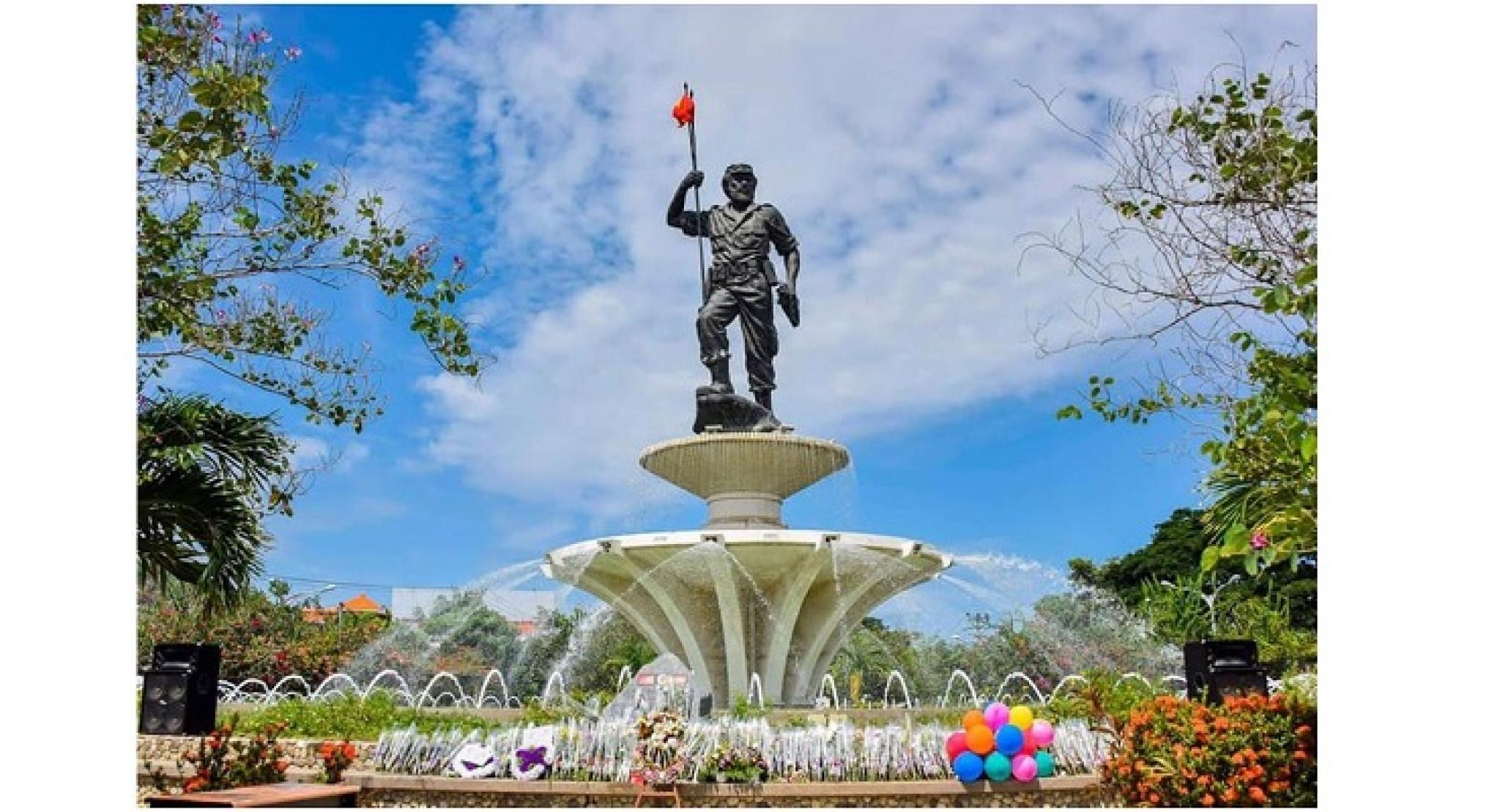 Image of Monument President Nicolau Lobato, Dili airport. Public domain, via Wikimedia Commons, by Gabinete Primeiru-Ministru: S.Exa. Taur Matan Ruak; https://commons.wikimedia.org/wiki/File:Rotunda_Aeroporto_2018-12-31.jpg 