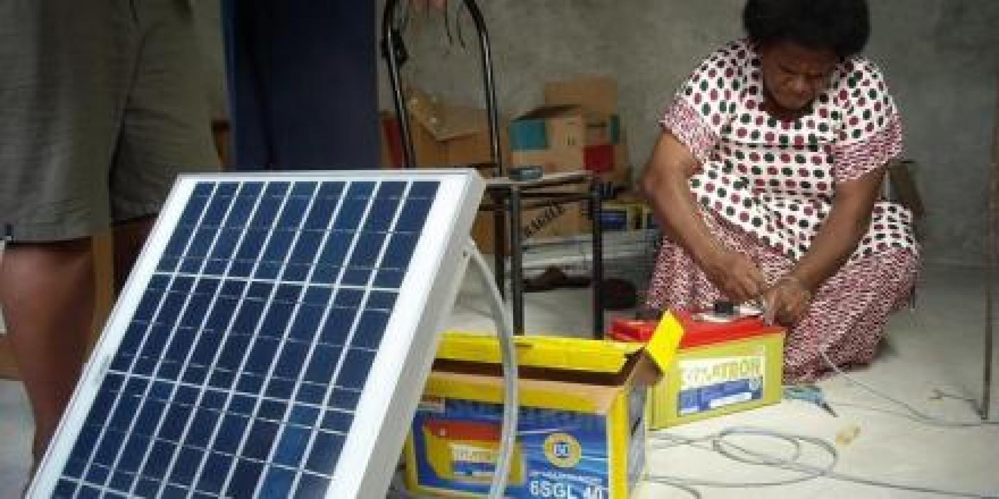 Image of Barefoot College woman graduate installing solar panels in Kadavu, Fiji. Photo by Laura Cleary from UN Women Pacific flickr account. https://flic.kr/p/nnM9m2  (CC BY-SA 2.0) https://creativecommons.org/licenses/by-sa/2.0/ 