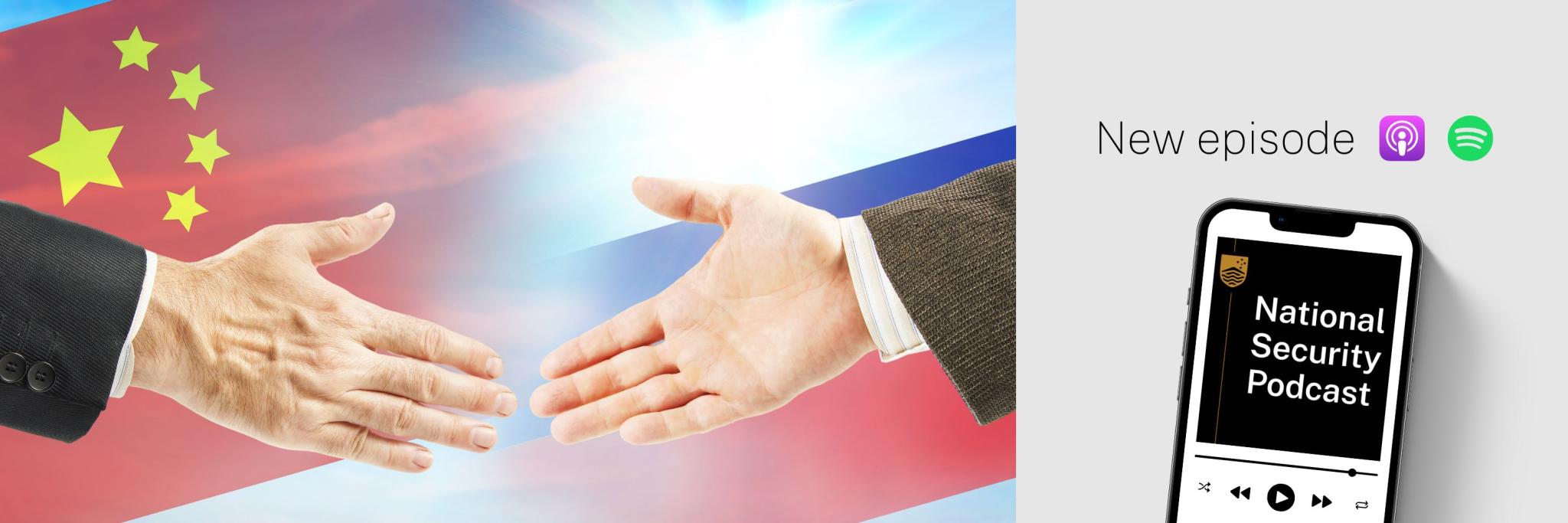 Image of a handshake with Chinese and Russian flags in the background