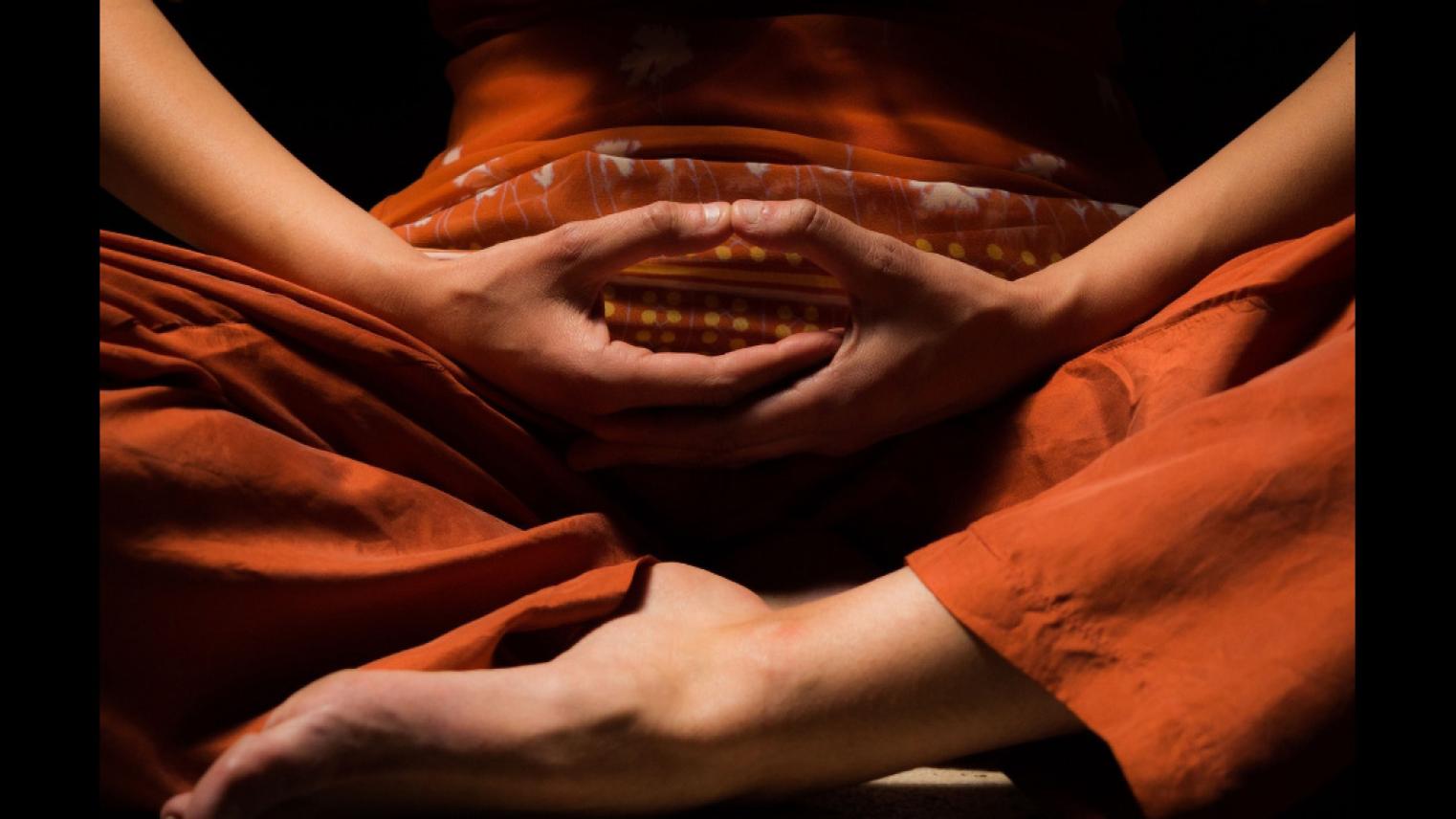 Yoga lotus pose with hands together