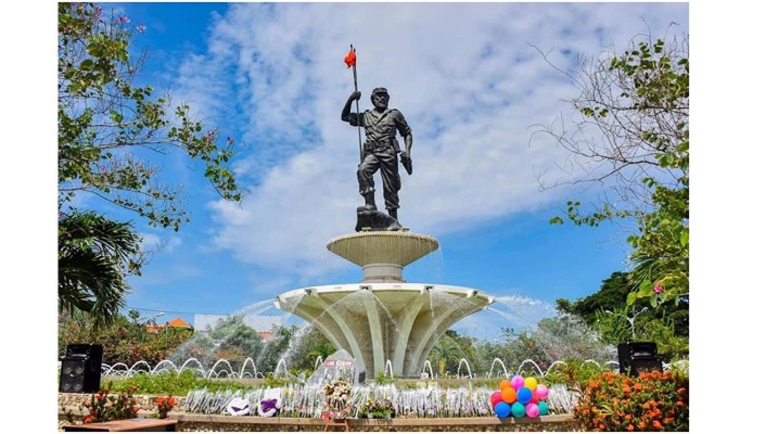 Image of Monument President Nicolau Lobato, Dili airport. Public domain, via Wikimedia Commons, by Gabinete Primeiru-Ministru: S.Exa. Taur Matan Ruak; https://commons.wikimedia.org/wiki/File:Rotunda_Aeroporto_2018-12-31.jpg 